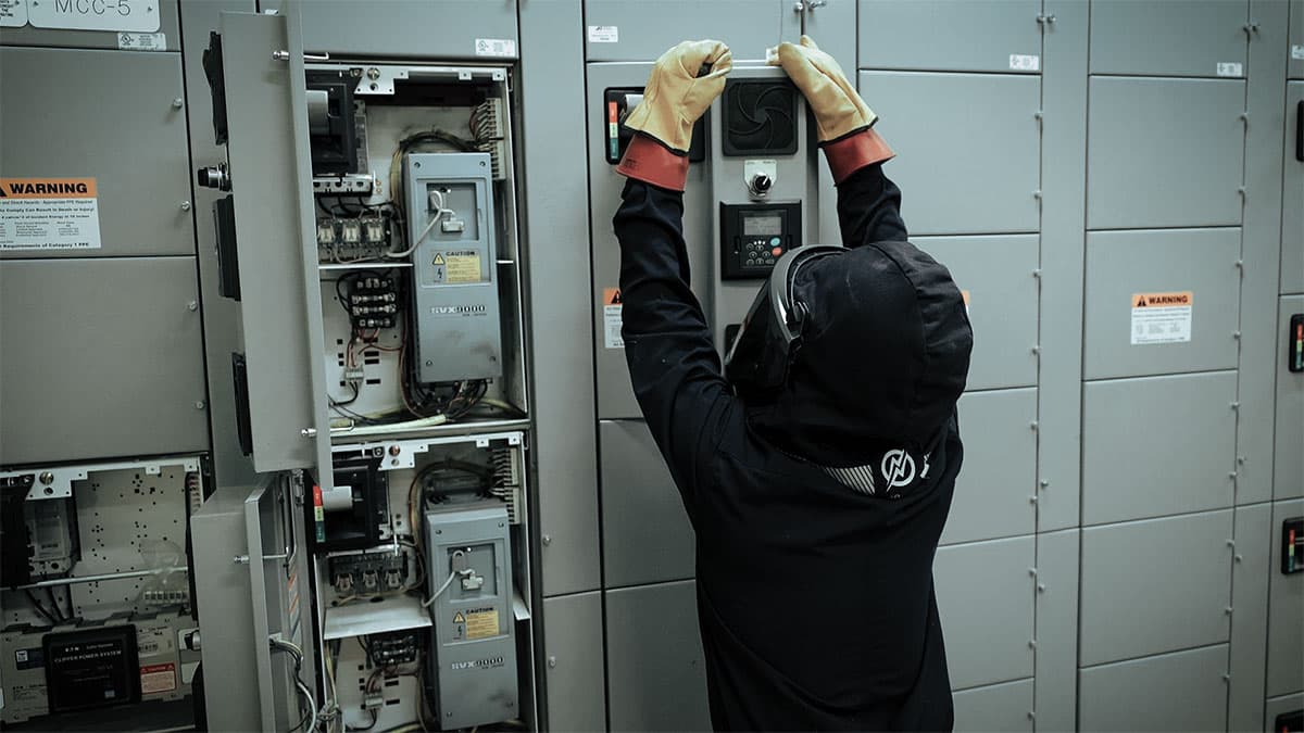 Electrical safety training with arc-rated PPE at industrial switchgear