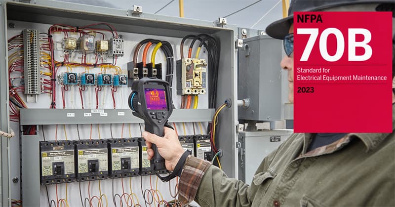 Technician reviewing switchgear maintenance with tablet